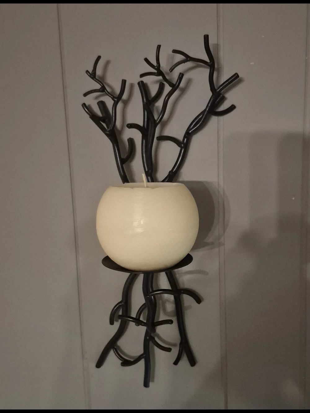 Wall-Mounted Brown Metal Branch Sconce with Cream Candle Holder. Its 17